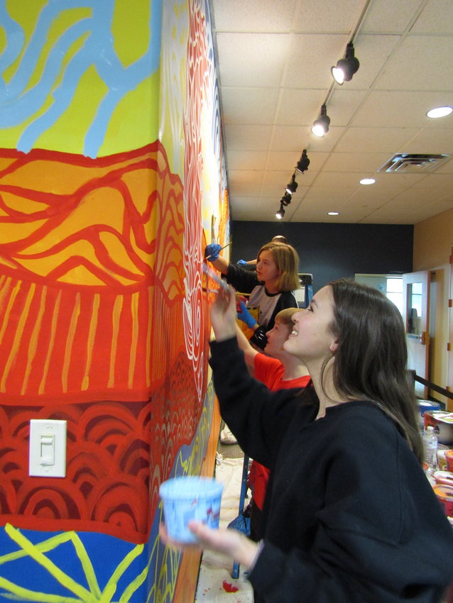Middle schoolers Izumi Hartshorne, Teddy Clark and Alyssa Kuhn work on the mural. They participated in a spring break workshop sponsored by Center for the Arts Evergreen.